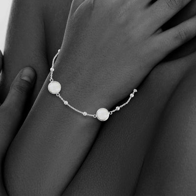 Sterling Silver Bezel Bracelet With Small Silver Stations And Moonstone Round Gemstones